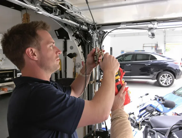 Brandon Garage Door Repair safety certified technician performing cable replacement in Brandon