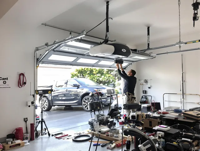 Brandon Garage Door Repair specialist installing smart garage door opener system in Brandon home
